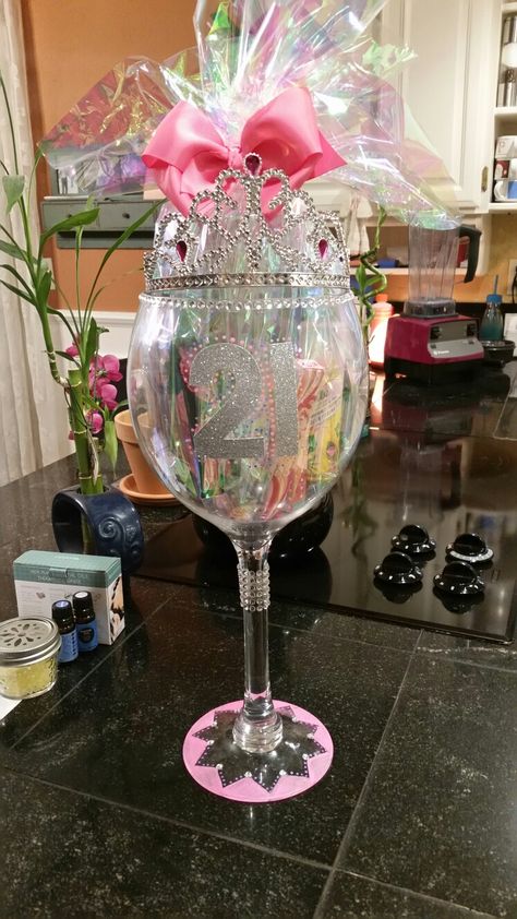 What I got my sister for her 21st birthday. Found a large wine glass, painted it and put all her gifts inside it. Hope she likes it Diy Gifts Sister, 21st Birthday Gifts For Girls, 21st Birthday Glass, Sister Gifts Diy, 21 Birthday Wine Glass, Wine Glass Decor, Birthday Presents For Girls, Diy Wine Glasses, Birthday Wine Glass