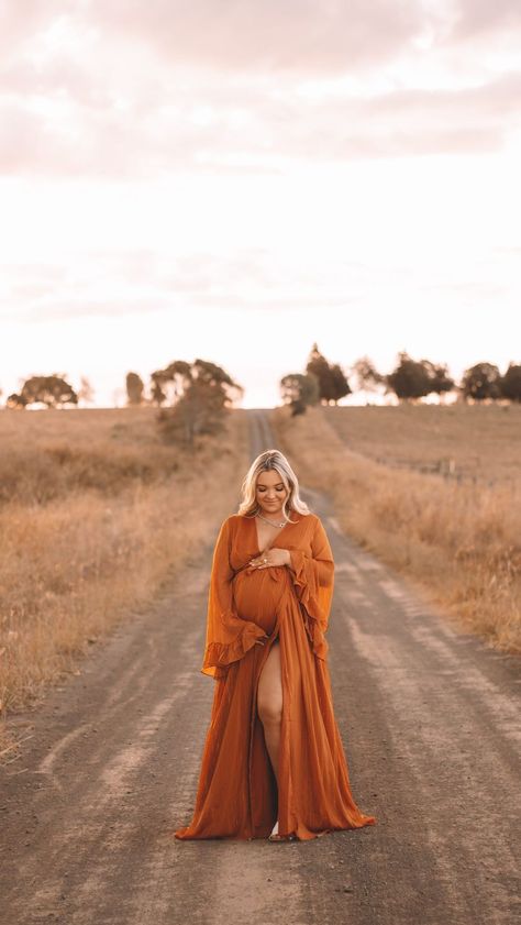 Congratulations @courtneeybyrnee on the safe arrival of your baby boy 💛✨ #stopgomotion #maternityshoot #maternity #goldenhour… | Instagram Formal Dress Maternity Photos, Western Maternity Dresses For Photoshoot, Dirt Road Maternity Photoshoot, Western Outfit Maternity, Rust Dress Maternity Shoot, Save The Date Photoshoot Outfits, Western Fall Maternity Pictures, Orange Maternity Photoshoot, Western Family Maternity Pictures