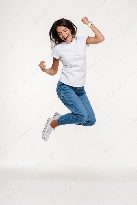 Free Photo | Portrait of a pretty joyful woman jumping Jumping Model Poses, Person Jumping Reference, Someone Jumping, Person Jumping, Joyful Woman, Force Activities, Jumping Pictures, Woman Jumping, Picture Of A Person