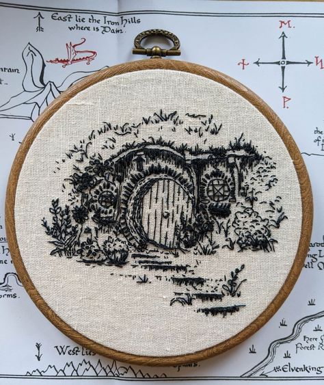 @ionaroseart on Instagram: “Saw in the New Year with the end of our annual lord of the rings rewatch and it reminded me of the very start of my embroidery journey with…” Lotr Decor, Casa Do Hobbit, Hole Embroidery, Ring Embroidery, Bag End, Lord Of The Ring, Hobbit Hole, French Knots, Sewing Embroidery Designs