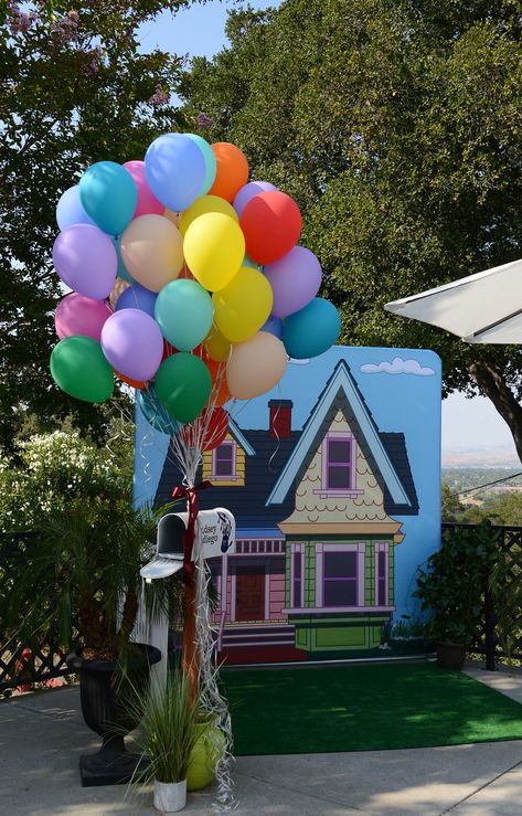 We can't believe how AWESOME the photobooth / UP movie inspired vingette turned out! Adventure is out there!!  printing and backdrop frame by RedCarpets.com Up Movie Backdrop, Disney Up Parade Float, Up Movie Trunk Or Treat, Up Theme Backdrop, Up Movie Decorations Party Ideas, Up Themed Gender Reveal, Up Gender Reveal Theme, Up Party Theme Disney, Up Movie Decorations