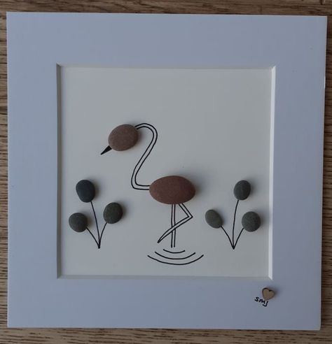 A mini mounted picture of a pebble flamingo. Pebble Crafts, Rock Pictures, Rock Creations, Sea Glass Art Diy, Stone Projects, Stone Pictures Pebble Art, Seaglass Art, Sand Glass, Pebble Art Family