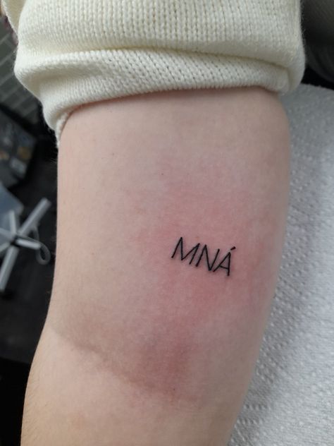 Black tattoo in typewriter font reads, MNÁ aka women in irish Irish Tattoos For Women Quotes, Tiny Irish Tattoos For Women, Irish Tattoos For Women, Small Irish Tattoos, Feminism Tattoo, Ireland Tattoo, Irish Tattoos, Irish Women, Cute Little Tattoos