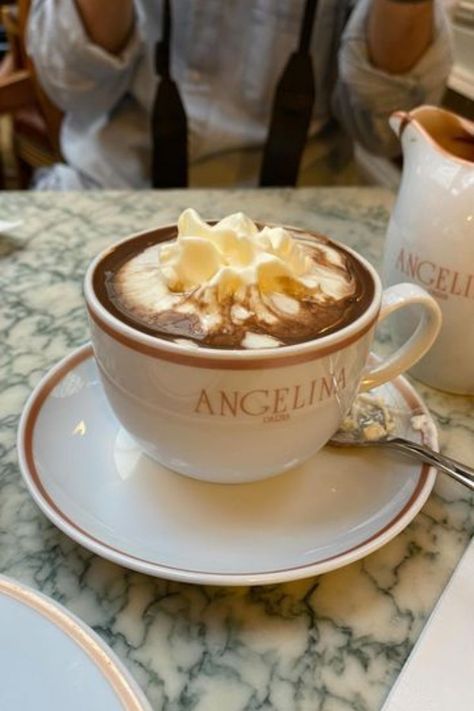 Imagine sipping the best hot chocolate in Paris as you gaze at charming streets and historic landmarks. This guide takes you to the most exquisite hot chocolate spots in Paris, including the famous Angelina Paris and the iconic Deux Magots. Each location offers more than just a drink; it's an experience, a taste of Parisian life. From rich and creamy to sweet and intense, find out why Paris's hot chocolate is the talk of the town. Start your delicious journey now! Angelina Paris Cafe, Angelina Hot Chocolate, Paris Angelina, Cafe Hot Chocolate, Parisian Hot Chocolate, Paris Hot Chocolate, Hot Chocolate Xmas, Hot Chocolate In Paris, Angelina Cafe