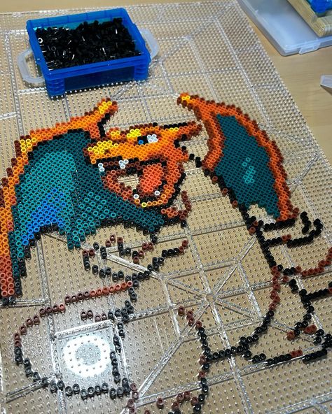 SOLD-This Perler Bead Charizard is one of my favorite projects to date! He is going up in my shop at 12:30pm Eastern tomorrow (04/23)at a discounted price! . . . . . . . . #charizard #pokemonmerch #pokemon #perler #perlerbeads #artkalbeads #hamabeads #hama #project #craft #sale #smallbusiness #product Pokemon Perler, Perler Bead, Craft Sale, Hama Beads, Perler Beads, I Shop, My Favorite, Pokemon, Beads