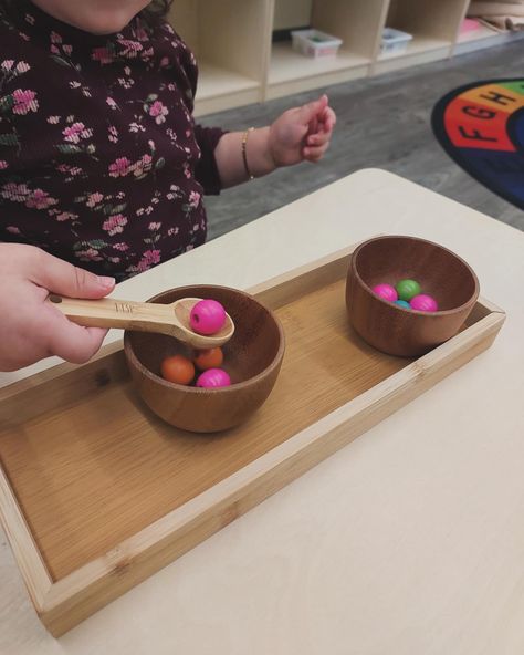 In the Toddler Room, the spooning activity is more than just an activity – it’s a fun way for little ones to develop essential practical life skills like focus, motor control, and hand-eye coordination! 🌱 Reach out to us to learn more about Montessori education and how we nurture each child’s development. #MontessoriToddler #PracticalLifeSkills #EarlyLearning #ottawadaycare #daycare Montessori Games, Practical Life Montessori Preschool, Practical Life Activities, Montessori Preschool, Montessori Toddler Activities, Montessori Education, Montessori Classroom, Practical Life, Montessori Toddler