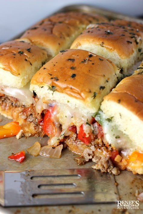 Sausage and Peppers Hawaiian Roll Sliders created by Renee's Kitchen Adventures - easy pull apart slider recipe made with Hawaiian rolls, Italian sausage, peppers, onions, and cheese baked in the oven and served warm. Great game day food, football food, or anytime snack or appetizer. Great for crowds. #GameDayfood #Footballfood #tailgating #sliders #Hawaiianrollsliders Sausage Sliders, Sliders Recipes Hawaiian Rolls, Roll Sliders, Slider Recipe, Hawaiian Roll Sliders, Sausage Peppers And Onions, Hawaiian Roll, Italian Sausage Recipes, Cheese Baked