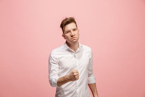 Young emotional angry man screaming on p... | Free Photo #Freepik #freephoto #people #man #face #human Hand On Head, Tired Man, Angry Women, Smiling Man, Professional Men, Brunette Woman, Man Standing, Pink Wall, The Ear