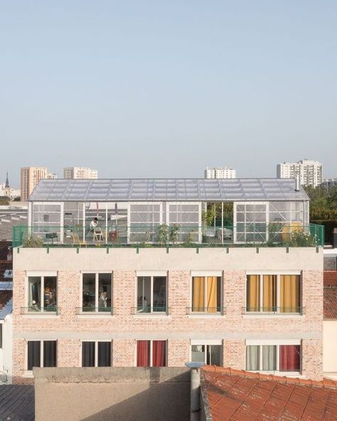 International publisher for architecture on Instagram: "Residential Building near Paris (FR) by @plancomun_ : Maison Commune by Plan Común is a self-commissioned residential project featuring five living units and generously proportioned communal areas. The building is made up of a rehabilitated rear building and a replacement of the former streetside one. On the roof terrace a structure enclosed in semi-transparent polycarbonate panels serves as a communal space with laundry and kitchen facilities. photos by @javieragustinrojas . . #detailmagazine #architecturemagazine #socialdesign #communalliving #communalspace #rehabilitation #reusereducerecyle #sustainablearchitecture #brickdesign #france #architecturephotography" Communal Living Architecture, Social Housing Architecture Plan, Evacuation Center Architecture, Rehabilitation Centre Architecture, Incremental Housing Architecture, Collective Housing Facade, Details Magazine, Collective Housing, Polycarbonate Panels