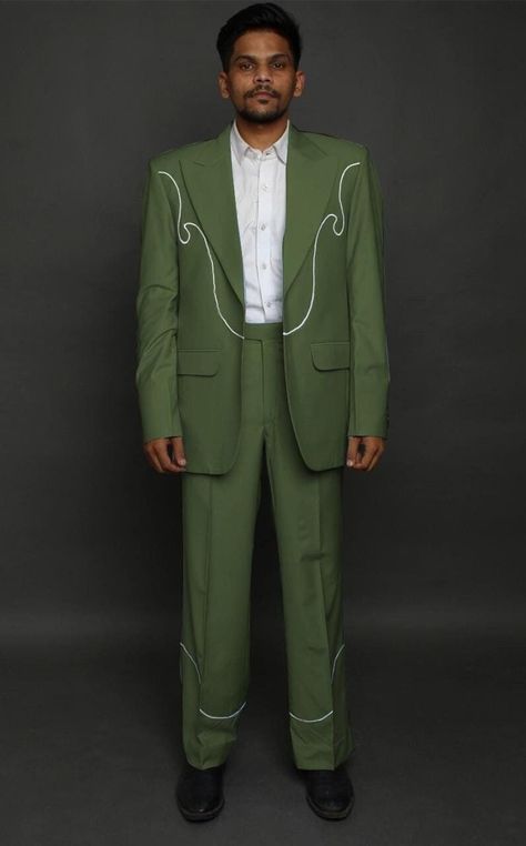 This unique bespoke suit features striking white wave embroidery on a Evergreen background, creating a modern and stylish Western-inspired look. The tailored fit and high-quality fabric make it a perfect choice for those who appreciate bold and distinctive fashion. Features : - Custom Made - Premium Cotton Fabric - Peak Lapel - Soft & Comfortable - Vivid Symbolism - Tailored Fit - Versatile Styling Care: - Dry Clean Only. Note: - Every monitor or mobile display can show colors differently, and each person may perceive those colors differently. The hue of a photograph can also be influenced by the lighting situation at the moment the photo was taken. - Our every outfit is custom made, we request you to kindly provide correct measurements as wrong inputs may lead to wrong outfits. Western Outfits Mens, Evergreen Background, Groomsman Ideas, Vintage Wedding Suits, Elope Ideas, Cowboy Suit, Wave Embroidery, Green Suit Men, Sun Wedding