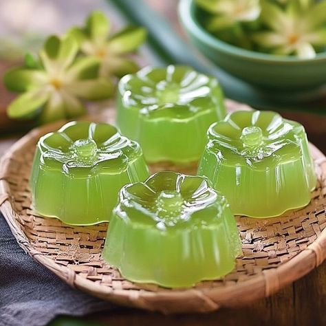 🌿🥥 Cool off with our refreshing Pandan Coconut Jelly! A perfect tropical dessert! 🍮✨ #TropicalDelight Pandan Coconut Jelly Ingredients: Coconut milk (2 cups) Pandan leaves or extract (2 tsp) Sugar (1/2 cup) Gelatin powder (2 tbsp) Water (1 cup) Instructions: Dissolve gelatin in water. Heat coconut milk with pandan leaves or extract and sugar. Remove pandan leaves and stir in gelatin mixture. Pour into molds and refrigerate until set. 🥥🌿 Enjoy the smooth and fragrant taste of this delightf... Gelatin Powder, Pandan Leaves, Tropical Desserts, Coconut Jelly, Instagram Recipes, Trending Recipes, 2 Cups, Tasty Dishes, Coconut Milk