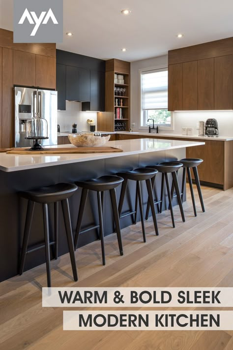 This open kitchen in AyA's warm rich Manhattan Rye Walnut doors paired with Kensington Pitch Black creates a bold but sleek aesthetic. A duo-tone kitchen space with a color palette and design sense that carries throughout with attention to detail. Visit ayakitchens.com and view our gallery and wide selection of door styles and finishes. Manhattan Kitchen Design, Black White Brown Home Interior, Walnut Modern Kitchen Cabinets, Walnut And Black Kitchen Cabinets, Black White And Brown Kitchen Modern, Walnut Two Tone Kitchen, Modern Kitchen Brown Cabinets, Black And Maple Kitchen, Kitchens Black Countertops