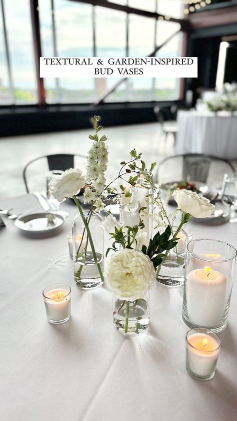 Graceful Blooms | Vibes and trends will change, but bud vases will always stay classy ✨ • Venue: @janserrstudio Catering: @sazshospitalitygroup... | Instagram Wedding Table Decor Bud Vases, Bud Vase And Floating Candle Centerpiece, Glass Bud Vases Centerpiece, Wedding Centerpieces With Bud Vases, Bud Base Center Piece Round Table, Bud Vase And Candle Centerpiece Wedding, Bud Vase And Candle Centerpiece, Bud Vases Round Table Wedding, Bud Vases And Candles Centerpiece