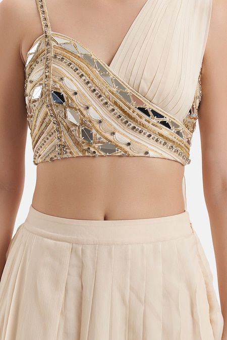 Buy Ivory Chiffon Hand Embroidered Mirror Asymmetric Neck Blouse And Skirt Set For Women by Divya Aggarwal Online at Aza Fashions. Stylish Embroidery Design, Draped Blouse Pattern, Trendy Outfits Indian, Lehenga Designs Simple, Latest Model Blouse Designs, Fashionable Saree Blouse Designs, Women Kurta, Padded Blouse, Elegant Blouse Designs