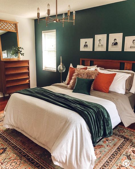 To my surprise, this post has gone viral on Pinterest. The color of the wall is Dark Everglade by @Behr . . . You do YOU, BOO! It may not… Jewel Tone Bedding Cozy, Dark Teal And Rust Orange Bedroom, Emerald Green And Burnt Orange Bedroom Ideas, Colorful Boho Bedroom Jewel Tones, Jewel Green Bedroom, Jewel Tone Master Bedrooms Decor, Dark Jewel Tone Bedroom, Dark Green And Orange Bedroom, Dark Green Wall Bedroom