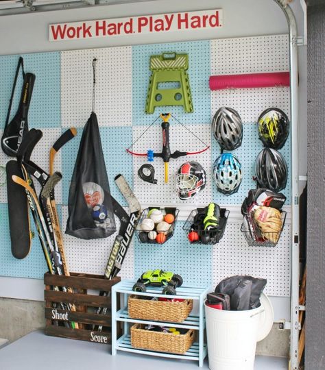 Love this DIY pegboard organizer for sports equipment. Could easily be customized for different sports equipment. #homeorganization #garageorganization #sportsequipment #sportsequipmentorganizer #pegboardorganizer Garage Organization Sports, Organize Sports Equipment, Outdoor Toy Organization, Toy Organization Ideas, Garage Pegboard, Sports Equipment Organization, Diy Pegboard, Pegboard Garage, Gear Room