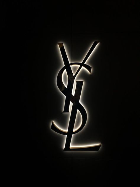 Gold Black Wallpaper Aesthetic, Eve Saint Laurent, Ysl Wallpapers Iphone, Ysl Logo Aesthetic, Black Vogue Aesthetic, Dark Expensive Aesthetic, Ysl Background, Saint Laurent Aesthetic Wallpaper, Chanel Logo Aesthetic