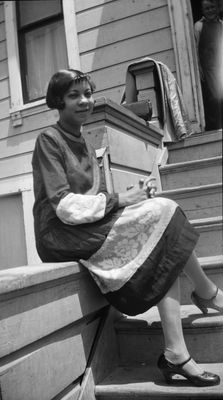 Woman sitting with legs crossed on front porch steps Sitting With Legs Crossed, Front Porch Steps, Dorothy Dandridge, Reference For Art, Eartha Kitt, Sitting Pose, Josephine Baker, Black Glamour, Porch Steps