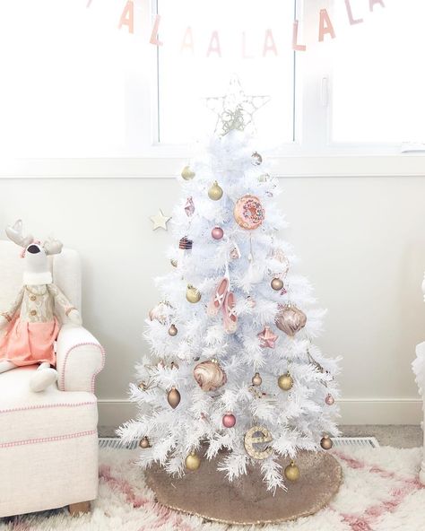 Pine is fine, but perhaps this year you're dreaming of a white Christmas tree. A pristine white tree instantly adds class to any room, and the possibilities Small White Christmas Tree, Mini White Christmas Tree, White Xmas Tree, Mini Christmas Tree Decorations, White Christmas Tree Decorations, White Christmas Tree Ideas, Rose Gold Christmas, Deco Rose, Pink Christmas Decorations