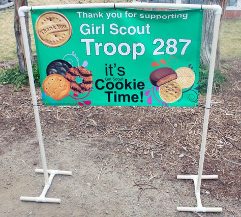 Homemade PVC Pipe 5′ x 5′ Banner Stand | Small Town Living in Nevada Pvc Banner Stand Diy, Pvc Sign Stand, Cookie Booth Decorations, Banner Stand, Cookie Booth, Cookie Booth Ideas Display, Make Your Own Banner, Gs Cookies, Girl Scout Cookie Sales