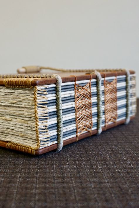 This is a handmade solid mahogany (150 mm x 210 mm) exposed spine sketching journal and notebook featuring a Celtic sewing with a coptic headband and spiral binding on hemp ropes. For more details about these books and how they're made visit ToeBeanBindery on Etsy #bookart #handmade #mahogany #woodenbook #journals #sketchbooks #bookbinding #bibliophile #exposedspine #sewing #papercraft #woodworking #bookish #designinspiration #handcrafted #makersgonnamake #woodbook #book #wood #woodwork Open Spine Book Binding, Spiral Book Binding, Sketching Journal, Bookbinding Techniques, Book Binding Design, Bookbinding Tools, Homemade Books, Handmade Sketchbook, Book Binding Diy