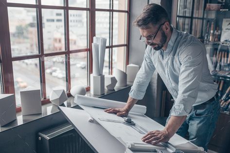 Mature man at work in the studio by AboutImages. Mature man with drawing at work#work, #man, #Mature, #drawing Effective Time Management, Men Photography, Project Photo, Architect Design, In The Studio, Graphic Design Art, The Studio, Photo Studio, Typography Design