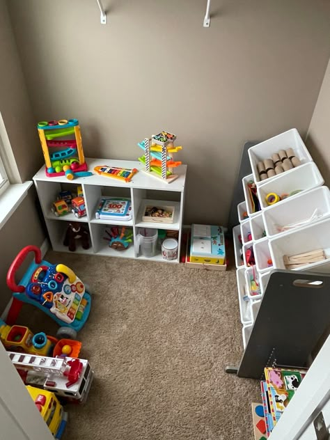 Playing Area In Living Room, Kids Ride On Toys Storage, Blocks Storage Ideas Toy, Mega Blocks Storage, Playroom Corner In Living Room, Baby Cube Toy, Infant Play Area, One Year Old Room, Daycare Building