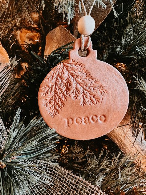 Terracotta Clay Textured Peace Ornament with Wooden Beads | Clay Gift Tag Fragile Set of 6 available in Etsy shop Clay Gift Tags, Beads Clay, Ceramic Christmas Decorations, Pottery Ornaments, Pottery Lessons, Bazaar Ideas, Clay Crafts Air Dry, Terracotta Clay, Clay Texture