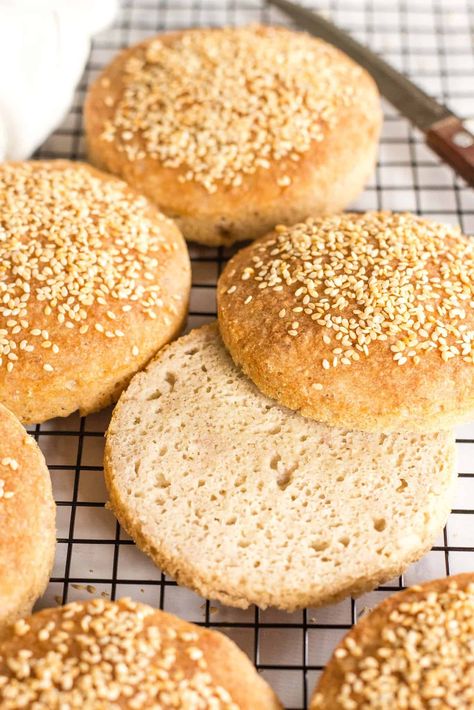 These soft and fluffy gluten-free burger buns are perfect for your summer backyard grilling party (or really anytime that you crave a good burger). Easy to make, these tender burger buns are studded with sesame seeds, and no kneading is required! Totally dairy-free too, but no one would care! | gluten-free buns | burger buns | gluten free dairy free recipes | gluten free bread recipes | gluten free yeast breads Dairy Free Hamburger Buns, Gluten Free Hamburger Buns Recipe, Gluten Free Burger Buns, Buns Recipe Easy, Grilling Party, Gluten Free Hamburger Buns, Gluten Free Hamburger, Gluten Free Burger, Hamburger Bun Recipe