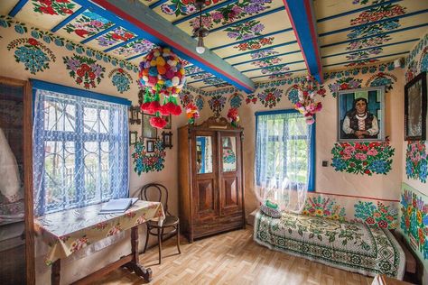 Located about 8 miles north-west of Dąbrowa Tarnowska, 5 miles west of Olesno, and 50 miles east of Kraków, Zalipie, also known as “The Painted Village,” is a lovely small town in Poland famous for its floral painted homes. Zalipie Poland, European Folk Art, Painted Cottage, Drone Design, Polish Folk, Colourful Living Room, Polish Colors, Bohemian Bedroom, Bohemian Design