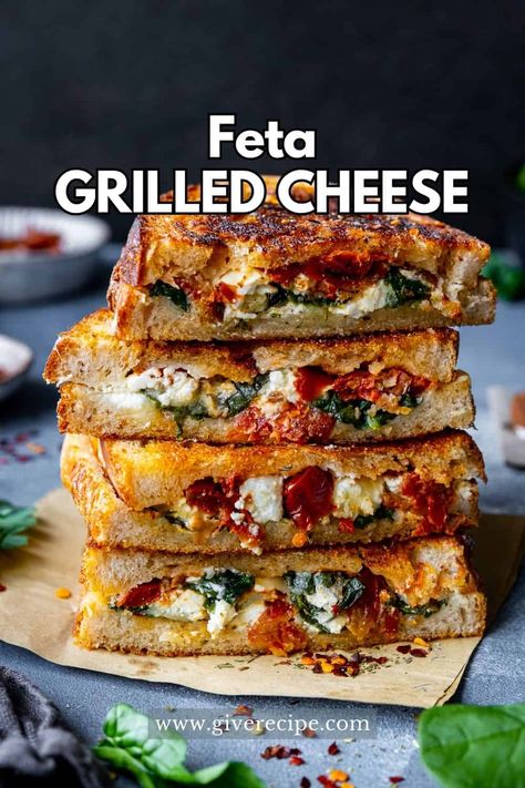 Spinach and Feta Grilled Cheese Sandwich, perfect for a quick and satisfying lunch. Packed with sautéed spinach, tangy feta, gooey cheddar, and sun-dried tomatoes, this easy-to-make sandwich will be your new go-to meal. Mens Lunch Box Ideas, Holiday Sandwich Ideas, Flat Bread Sandwich Ideas, Sandwich Recipes Cold, Feta Dishes, Healthy Sandwiches For Lunch, Feta Grilled Cheese, Winter Sandwiches, Fall Sandwiches