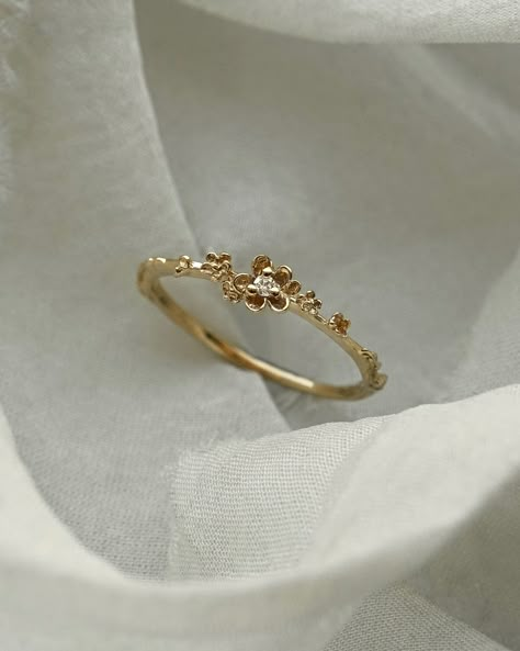 Petite petals of gold to float across your finger🌼 Our Buttercup Ring with a drop of diamond dew glittering at her centre — today is your last chance to get this special customization and more for 15% off on our website! Our Secret Menu Sale ends tonight at 11:59pm EST🧚 Rings On Fingers Aesthetic, Rings Gold Aesthetic, Promise Rings Gold, Buttercup Ring, Laurie Fleming, Stylish Jewelry Accessories, Magical Wolf, Hand Jewelry Rings, Buttercup Flower