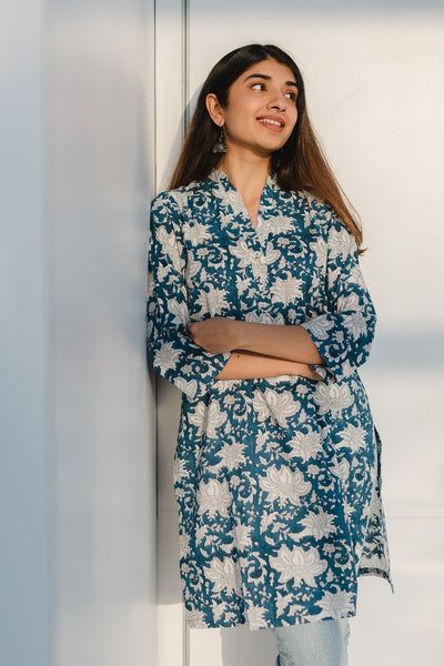 Product Description: Refreshing, earth friendly and versatile styles add value to your daily wears. Made in comfortable cotton fabric and Sanganeri hand block print. Features a Collar Neck with button detailing in front Short kurta with full sleeves along with side pockets. Size and Fit: Model height is 5'3" and is wearing a Size S Fit: Straight fit Contents: 1. Kurta Material:  This kurta is made up of Slub cotton. Short Sleeve Kurti, Short Kurti Designs, Cotton Short Tops, Indian Kurtis, Desi Outfits, Kurtas For Women, Kurta Cotton, Short Kurta, Simple Kurti Designs