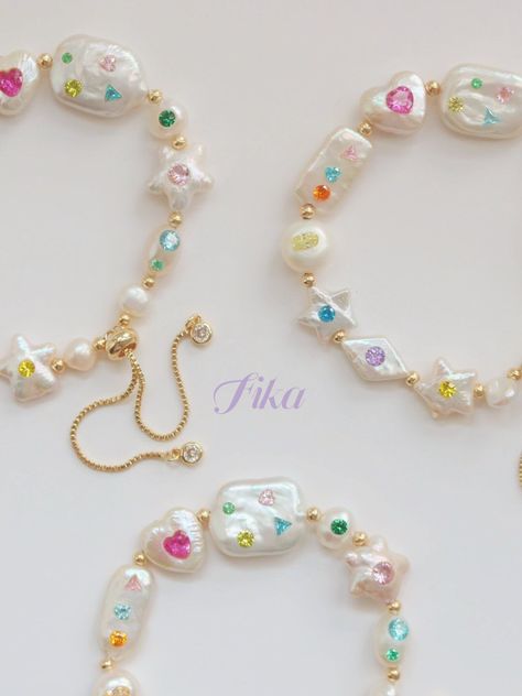 We cannot get enough of how cute this is!! These fun and quirky pieces feature a range of different shaped freshwater pearls (star, hearts, pebble, flat, diamond, and various sized baroque pearls) with multicolored and multishaped zircon, and must be a supermodel because she has no bad angle in sight. Sure to bring a smile to your face every time you put it on - certainly does for us! This bracelet can fit sizes from 17-28cm as it has a special close. The necklace can fit 35-40cm. Each pearl is Pearl Jewellery Diy, Star Pearl Necklace, Candy Garden, Diy Pearl Jewelry, Pop Jewelry, Pretty Jewelry Necklaces, Pearl Heart, Handmade Jewelry Diy, Jewelry Lookbook