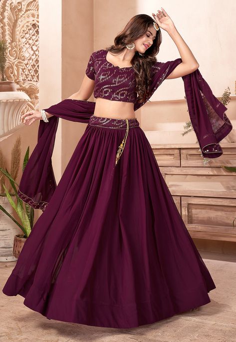 Unstitched Faux Georgette Lehenga in Wine This attire with Faux Crepe Lining is Enhanced with Resham, Zari, Sequins and Patch Border Work Available with a Unstitched Faux Georgette Choli in Wine and a Faux Georgette Dupatta in Wine The Semi-Stitched Lehenga Waist and Hips are Customizable from 28 to 36 inches and from 36 to 46 inches respectively and Lehenga Length is 40 inches Do Note: Accessories shown in the image are for presentation purposes only. (Slight variation in actual color vs. imag Modern Lehangas, Lehenga Type, Queen Purple, Sequins Lehenga, Purple Lehenga, Lehenga Choli Designs, Georgette Lehenga, Lehenga Fabric, Party Wear Lehenga Choli