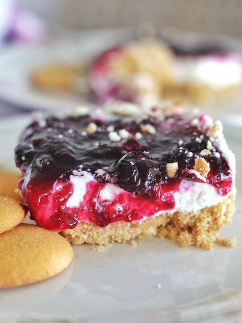 Grandma's Blueberry Delight - no-bake, layered dessert made of Nilla wafers, whipped cream and blueberry compote. #cakebycourtney #blueberrydelight #nobakedessert #layereddessert Nilla Wafer Crust, Whipped Cream Filling, Cake By Courtney, Blueberry Delight, Layered Dessert, Blueberry Coffee, Blueberry Coffee Cake, Caramel Apple Cheesecake, Blueberry Compote