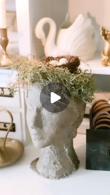 20K views · 1.1K likes | Erin Sowell on Instagram: "It’s no secret that I love vintage inspired bust planter’s and have several, but it sure is fun when you can make your very own.   Using a simple styrofoam mannequin head from @hobbylobby , I simply cut out a “planter” spot in top of the head, covered entire form with air dry clay, molding it and forming hair, ears and more to form and when dry, applied dark antiquing wax and gray chalk paint to give a concrete appearance.   Such a fun project and I now have a unique, one of a kind bust planter of my own to style in our home. Adding a little moss and a sweet birds nest to top was a fun little addition and I can easily change it out throughout the year with faux succulents, plants or floral stems.   Do you love bust planter’s also?   XO ~ Foam Head Planters, Bust Plant Pot, Concrete Doll Head Planter, Head Planters Ceramic, Iod Molds Projects Pots & Planters, Styrofoam Head, Gray Chalk Paint, Head Planters, Mannequin Heads