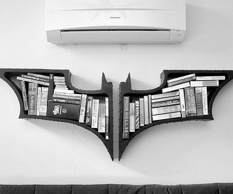 Store your books, dvds, and other home paraphernalia on a bookshelf you deserve, but don't need right now with this Batman bookshelf. With a Nolan Batman series inspired design of the bat symbol, this unique bookshelf is a must have home decor piece. Batman Bookshelf, Geek Home Decor, The Dark Knight Trilogy, Geek Decor, Batman The Dark Knight, Dc Comic, The Batman, Book Shelf, Design Case