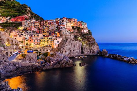 Traveling to Cinque Terre, Italy (The Points Guy). A stunning view of Manarola at twilight. Italy December, Ligurian Coast, Montecatini Terme, Italy Tourism, Traveling Aesthetic, Bucket List Vacations, Liguria Italy, Cinque Terre Italy, Time To Travel