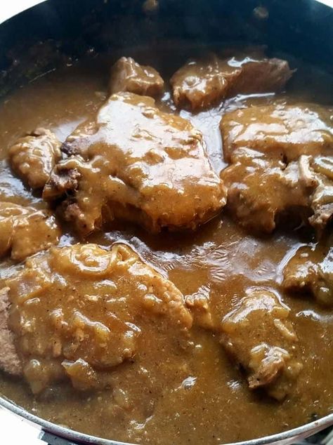 Slow Cooker Pork Chops with Gravy are fork tender, tasty and smothered in a rich creamy onion gravy.  Easy to make and fail proof, these Slow Cooker Pork Chops with Gravy will prove you will never over cook pork chops again! | A Wicked Whisk | https://www.awickedwhisk.com #porkchops #slowcookerporkchops #porkchopsingravy #slowcookerporkchopswithgravy #slowcookercomfortfood #comfortfood Pork Cutlets Crockpot, Slow Cook Pork Chops, Pork Gravy Recipe, Smothered Pork Chops Crock Pot, Pork Chops With Gravy, Crockpot Potatoes, Cook Pork Chops, French Onion Pork Chops, Crockpot Meat