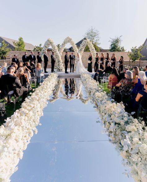 Exquisite Memories⁠ ⁠ A stunning wedding filled with unforgettable moments. The ceremony featured a magical mirror aisle adorned with florals, creating an incredible backdrop for this special day.⁠ ⁠ Planning & Design: @coledrakeevents ⁠ Venue & Catering: @stanlyranchauberge ⁠ Photography: @johnandjoseph ⁠ Videography: @niceshotfilms ⁠ Florals: @flowersbyedgar ⁠ Paper Stationery: @paperhabit ⁠ Ceremony Music: @winecountryentertainment ⁠ Live saxophone: @justinwardmusic⁠ Officiant: Tim Boeve⁠ ... Stage Backdrop Wedding, Ceremony Flowers Altar, Mirror Aisle, Magical Mirror, Wedding Ceremony Setup, Day Planning, Wedding Ceremony Ideas, Stage Backdrop, Ceremony Music