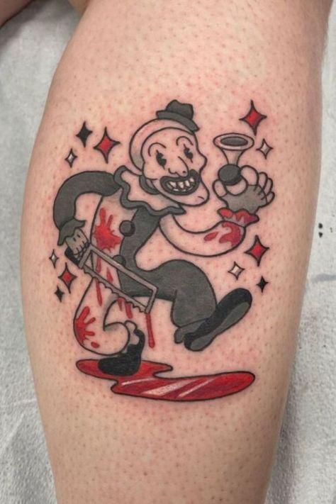 "From minimalist to detailed designs, these Art the Clown tattoo ideas make for perfect small tattoos that honor this infamous character." Cartoon Horror Tattoos, The Terrifier Tattoo, How To Draw Tattoos On Characters, Horror Movie Sleeve Tattoo, At Home Tattoo Ideas, Horror Flash Tattoo, Halloween Traditional Tattoo, Art The Clown Drawing, Art The Clown Tattoo