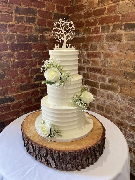 Beautifully simple 3 tier buttercream frosted wedding cake decorated with artificial roses & gypsophilia and a tree of life topper Wedding Cake Three Tire, Simple 3 Tier Wedding Cake, Simple Wedding Cake 3 Tier Fresh Flowers, 3 Tier Textured Wedding Cake, 2 Tier Wedding Cake Textured, Frosted Wedding Cake, 3 Tier Wedding Cake Rustic Garcia Topper, Cake Texture, Spiderman Cake Topper