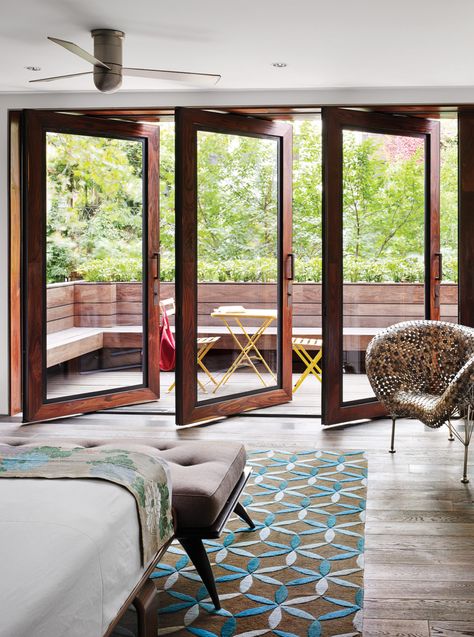 In Tia Cibani's master suite, the architect created a sizable terrace. The wood floors within the room run right out of doors, establishing a subtle sense of continuity. Thus, says Dubbeldam, “the balcony becomes part of the bedroom.” The coin chair is by Johnny Swing. The bed is from Design Within Reach. Terrasse Design, Balcony Doors, Exterior Modern, Attic Renovation, Bedroom Balcony, Sliding Glass Doors, Chelsea House, Terrace Design, घर की सजावट