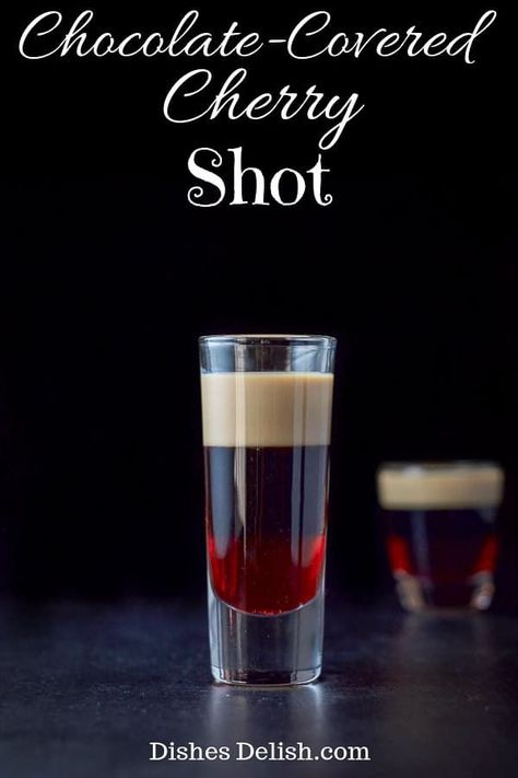 This chocolate-covered cherry shot tastes like the the famous candy!  It is one of the tastiest layered shots out there! #cherry #chocolatecoveredcherry #layeredshot #dishesdelish via @dishesdelish Layered Shots, Glace Fruit, Chocolate Covered Cherry, Chocolate Shots, Cocktail Shots, Jello Shot, Shots Alcohol, Liquor Drinks, Chocolate Covered Cherries