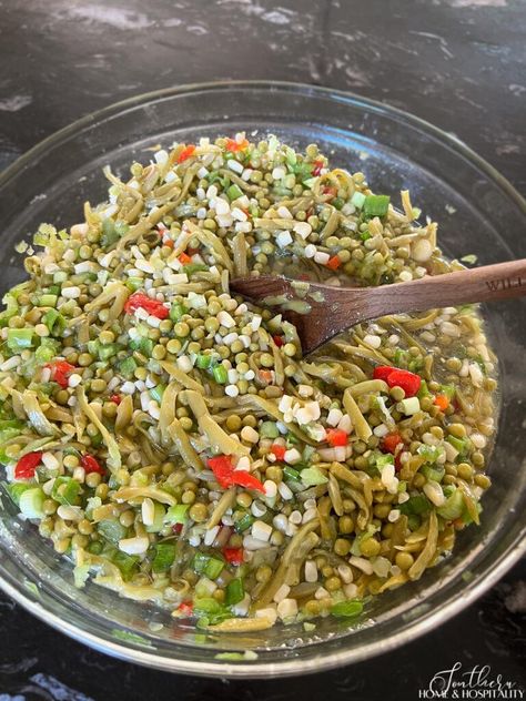 This classic chilled vegetable salad recipe is made with white shoepeg corn, French-style green beans, Le Sueur English peas, and marinated in a sweet and tangy oil and vinegar dressing. It's the perfect side dish for potlucks, picnics, barbecues, and any summer meal! Shoe Peg Corn Salad, Shoepeg Corn Salad Recipe, Marinated Salad Recipes, Shoe Peg Corn, Cold Pea Salad, Marinated Green Beans, Shoepeg Corn, Oil And Vinegar Dressing, Green Pea Salad