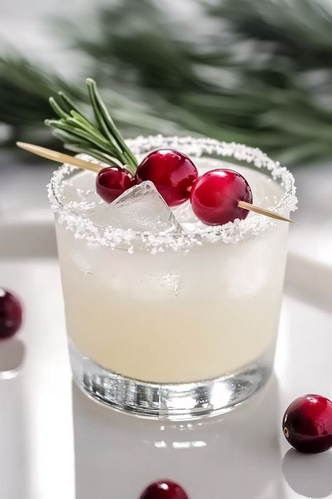 Refreshing White Christmas Margarita with White Cranberry Juice White Xmas Margaritas, White Cranberry Spritz, Drinks With White Cranberry Juice, White Cranberry Mimosa, White Cranberry Christmas Cocktail, White Christmas Mocktail, White Christmas Margaritas, White Cranberry Cosmo, Xmas Alcoholic Drinks