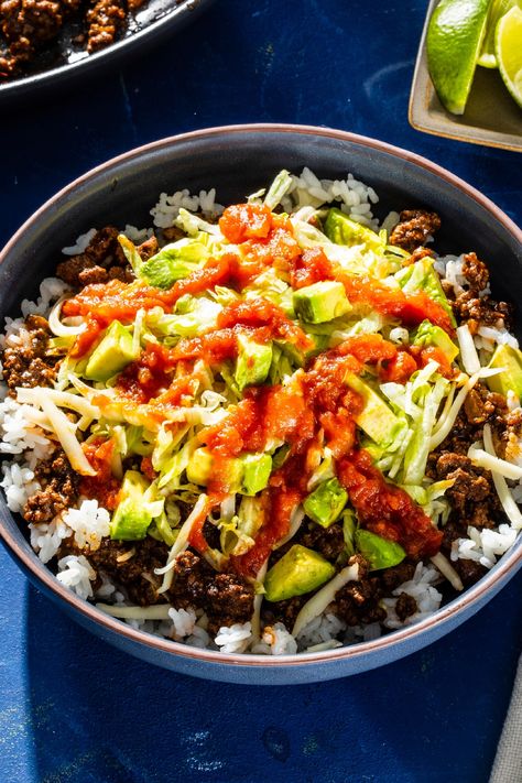 Discover the origin story of Taco Rice, the Tex-Mex classic from Okinawa created by Matsuzo Gibo in 1984. Our easy, weeknight-friendly recipe enhances the traditional taco seasoning with umami-rich dashi, mirin, and soy sauce. Creamy cheese, crisp lettuce, and tangy salsa take this dish to the next level. Cooks Country Recipes, Country Dinner, Taco Rice, Spiced Beef, Ground Beef Tacos, America's Test Kitchen Recipes, Inexpensive Meals, America's Test Kitchen, Cooks Illustrated