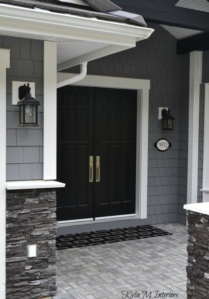 exterior of home with chelsea gray painted shakes, black painted double front door and white trim with dark charcoal ledgestone Grey Exterior House Colors, Black Front Door, Gray House Exterior, Best Exterior Paint, House Paint Color Combination, Black Shutters, Color Combinations Paint, Gray House, Exterior House Paint Color Combinations