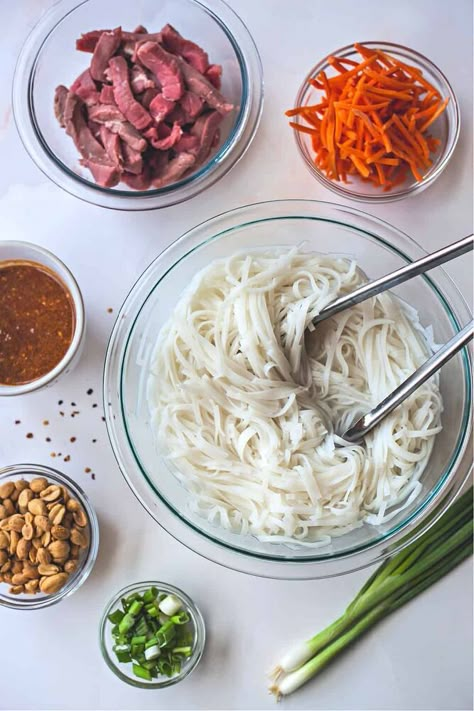 This easy, less-than-30-minute recipe for Beef Pad Thai with Crunchy Peanuts is a beautiful bowl of tender beef and silky rice noodles with dry-roasted peanuts in a delicious creamy sauce.Tamarind paste, a basic ingredient in traditional Pad Thai, is not always readily available at mainstream grocery stores. Instead, to avoid a trip to the Asian market, this Beef Pad Thai recipe uses a tablespoon of ketchup, extra rice wine vinegar, and Worcestershire sauce to mimic the sweet, tangy ta… Beef Pad Thai Recipe, Thai Ingredients, Beef Picadillo, Carrot Pasta, Thai Rice Noodles, Thai Beef, Thai Recipe, Pad Thai Recipe, Tamarind Paste